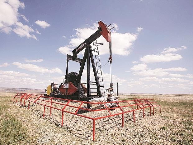 Oil prices jump 8% on stimulus hopes, spending cuts by US producers